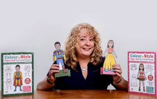 Photograph of Carmel Grant showing the Colour & Style paper doll books