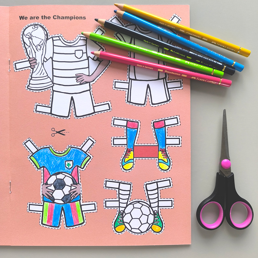 Inside page of Sports Star paper doll book with colouring pencils and scissors