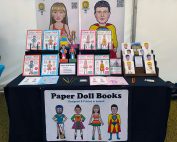 Paper Doll Books and caricature greeting cards by Carmel Grant Designs for sale at market stall