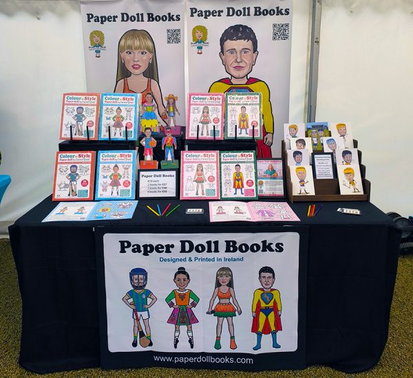 Paper Doll Books and caricature greeting cards by Carmel Grant Designs for sale at market stall